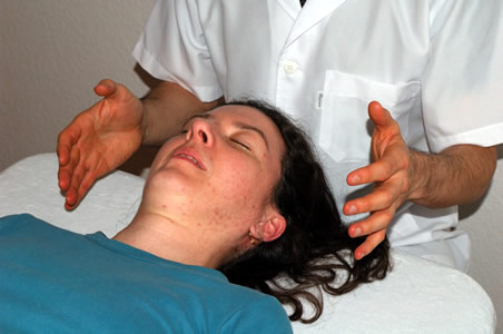 Marcos performing a Facial lift massage as part of a client treatment</perch:content>