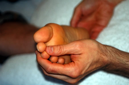 Marcos performing a Reflexology treatment</perch:content>