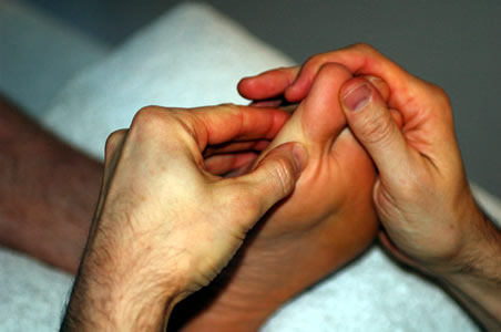 Marcos performing a Reflexology treatment</perch:content>